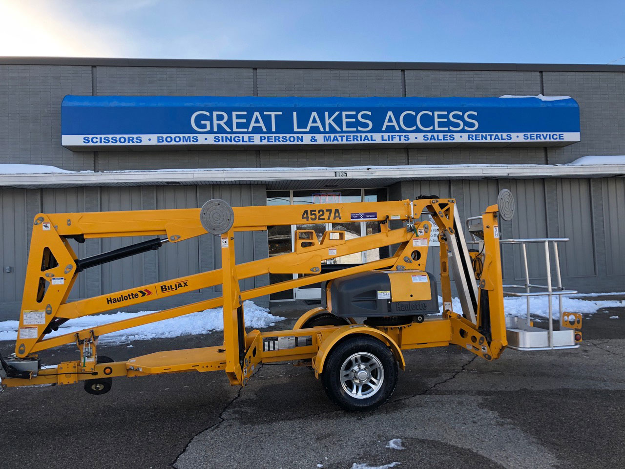 Great Lakes Access storefront behind trailer boom lift